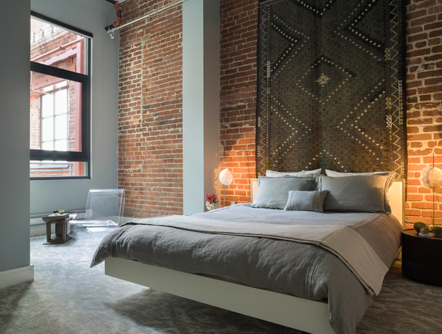 Modern Loft Bedroom with Exposed Brick + Textile Wall Art contemporary-bedroom