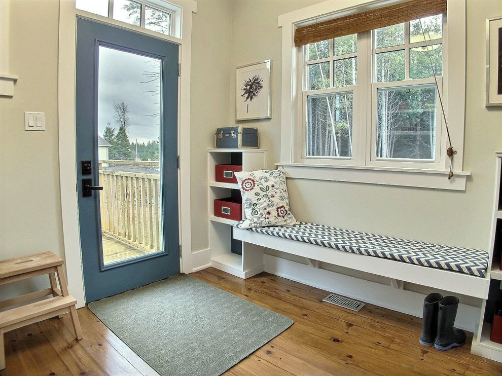 Design ideas for a mid-sized traditional mudroom in Ottawa with white walls, medium hardwood floors, a single front door and a blue front door.