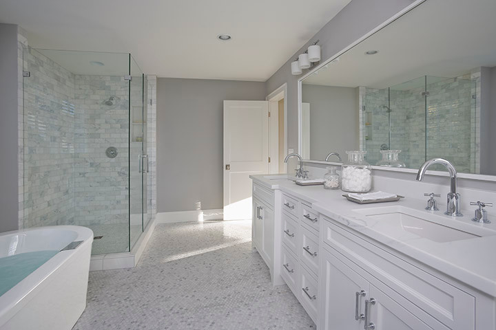 Mid-sized traditional master bathroom in Minneapolis with shaker cabinets, white cabinets, a freestanding tub, a corner shower, grey walls, mosaic tile floors, an undermount sink and marble benchtops.