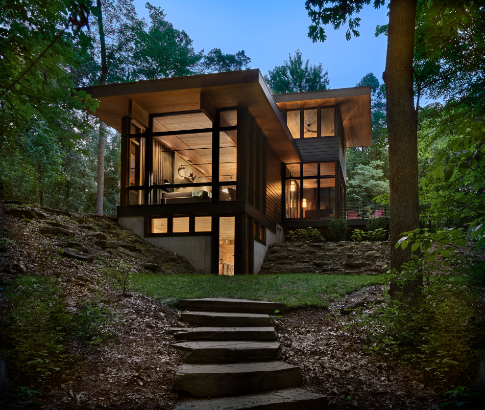 Lawless Retreat - The site's privacy permitted the use of extensive glass. Overhangs were calibrated to minimize summer heat gain.