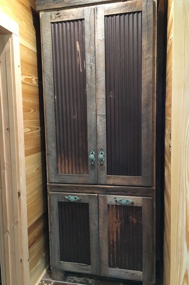 Mountain style master home design photo in Jackson with recessed-panel cabinets and medium tone wood cabinets