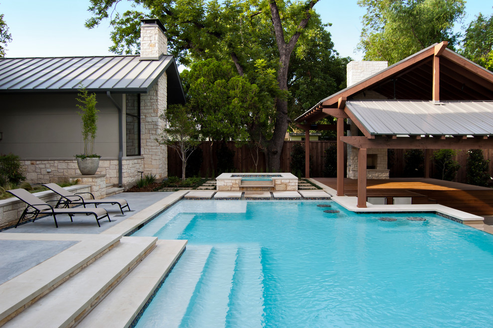 This is an example of a contemporary custom-shaped pool in Dallas.