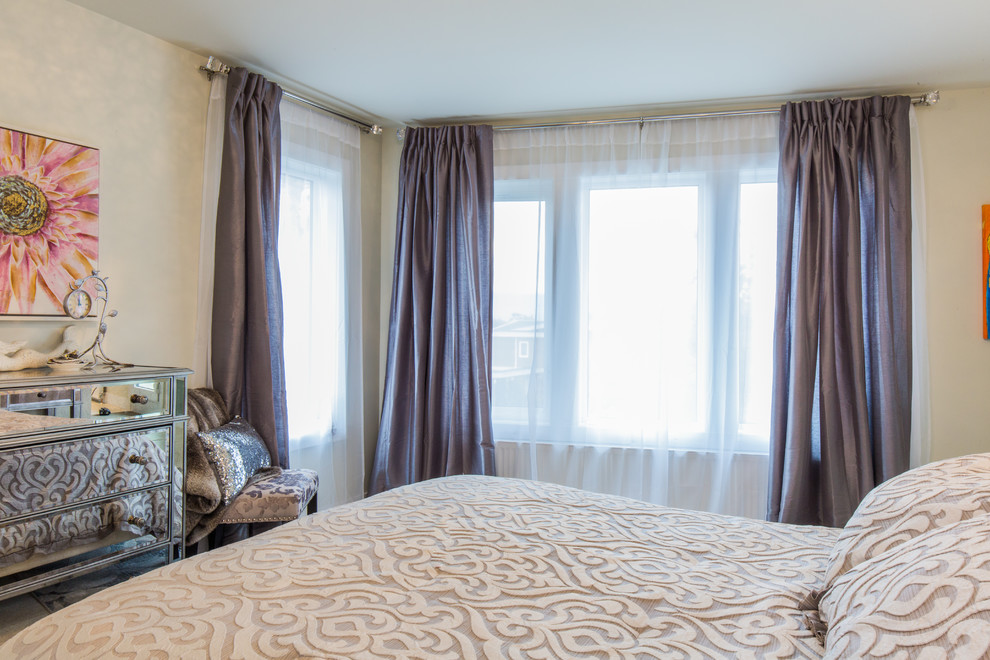 Example of a mid-sized transitional master bedroom design with beige walls and no fireplace