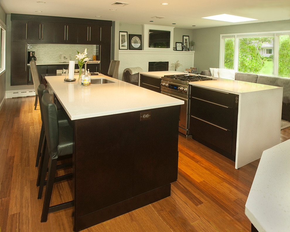 Inspiration for a kitchen remodel in Chicago with flat-panel cabinets, dark wood cabinets and two islands