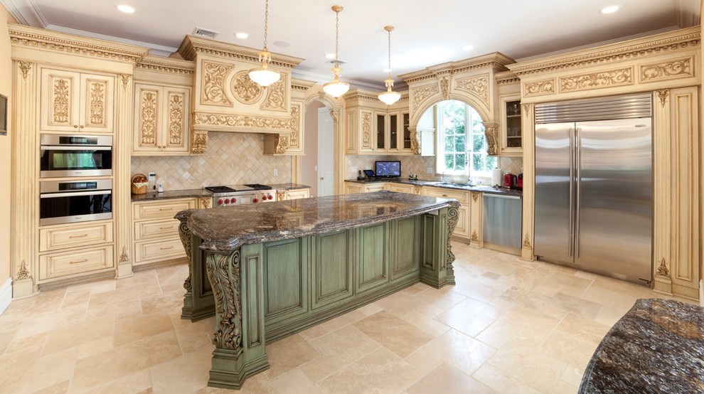 Inspiration for a large traditional l-shaped eat-in kitchen in New York with beige cabinets, stainless steel appliances, an undermount sink, raised-panel cabinets, granite benchtops, beige splashback, ceramic splashback, travertine floors and with island.