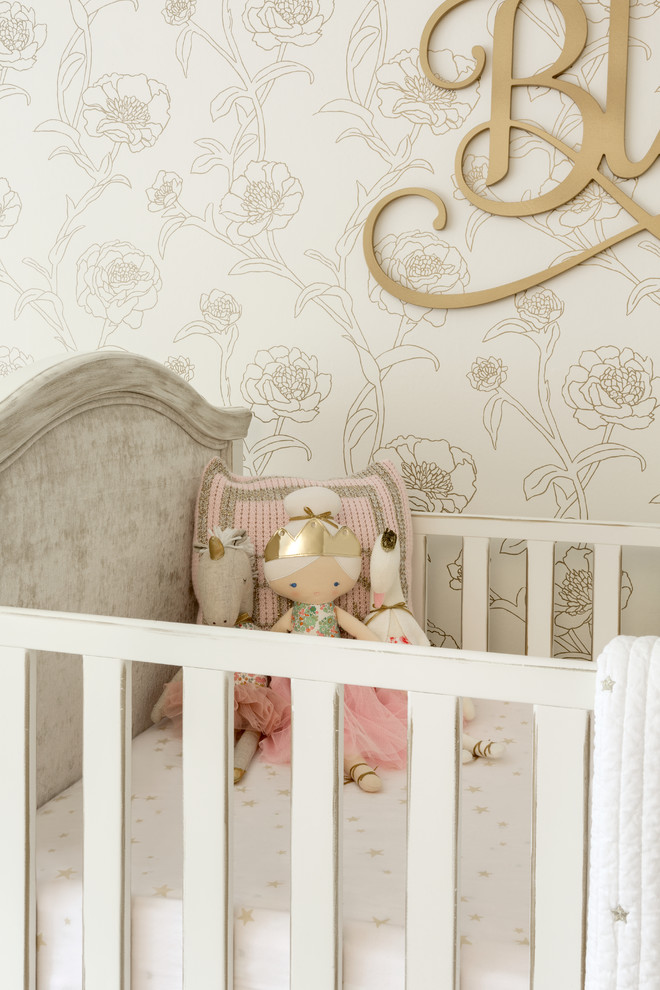 Inspiration for a mid-sized transitional nursery for girls in New York with carpet.
