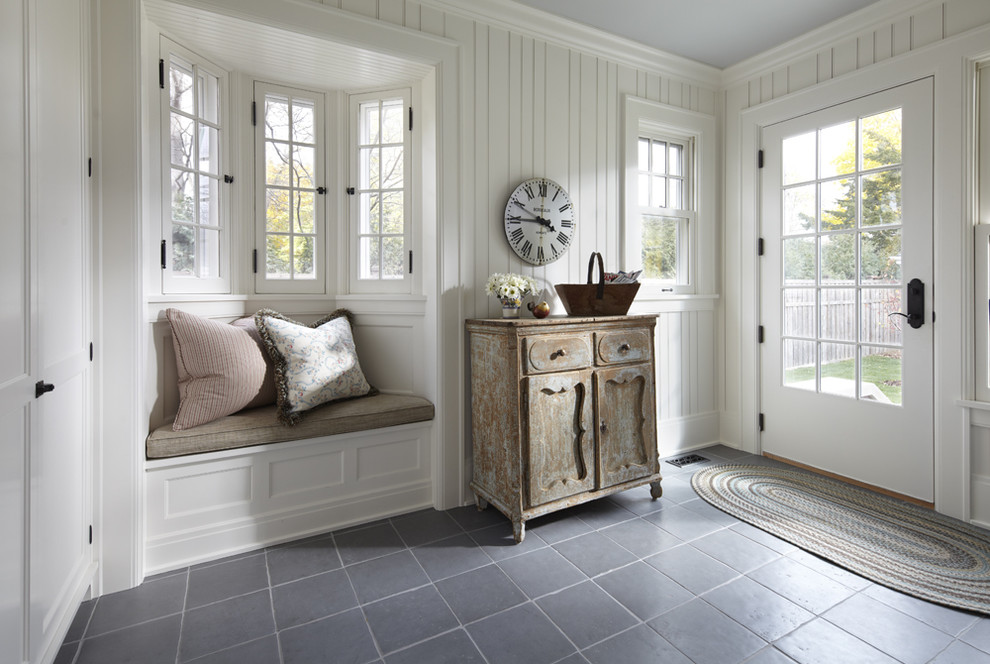 Inspiration for a traditional entryway in Minneapolis with white walls, a single front door, a white front door and ceramic floors.