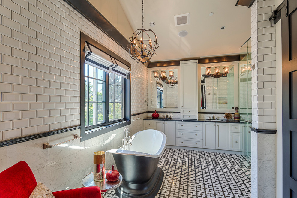 Inspiration for a large arts and crafts master bathroom in Vancouver with an undermount sink, shaker cabinets, white cabinets, a freestanding tub, a double shower, white tile, subway tile, white walls and ceramic floors.