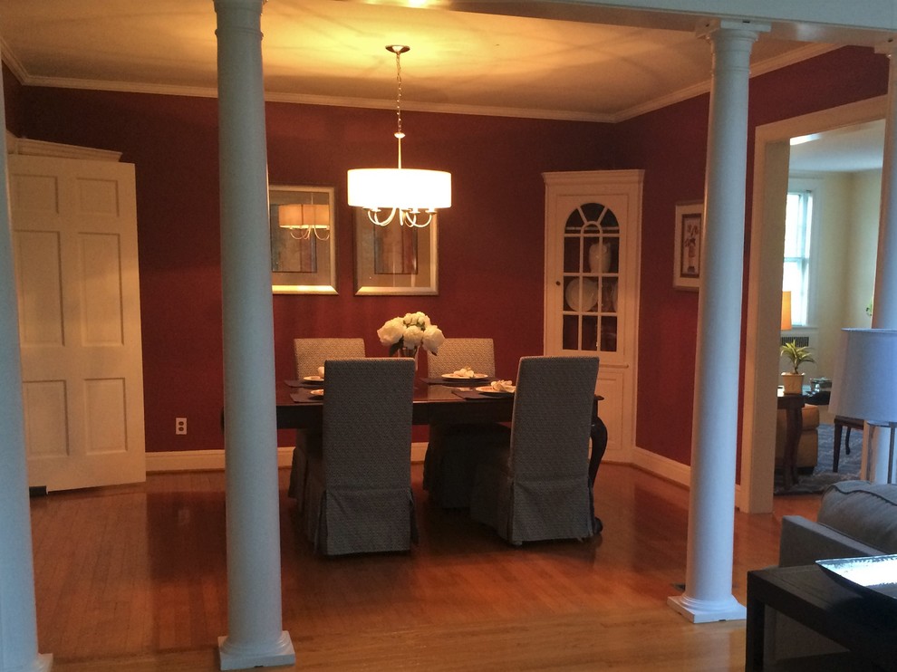 Example of a mid-sized transitional medium tone wood floor great room design with red walls