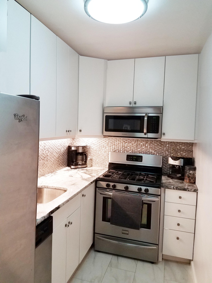 This is an example of a small contemporary l-shaped separate kitchen in New York with an undermount sink, flat-panel cabinets, marble benchtops, metallic splashback, metal splashback, stainless steel appliances, marble floors and no island.