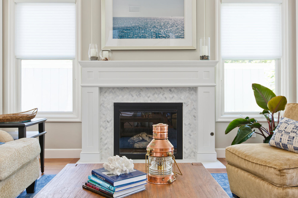 Inspiration for a large coastal u-shaped medium tone wood floor and brown floor open concept kitchen remodel in Denver with a farmhouse sink, recessed-panel cabinets, white cabinets, quartzite countertops, gray backsplash, stone tile backsplash, stainless steel appliances and an island