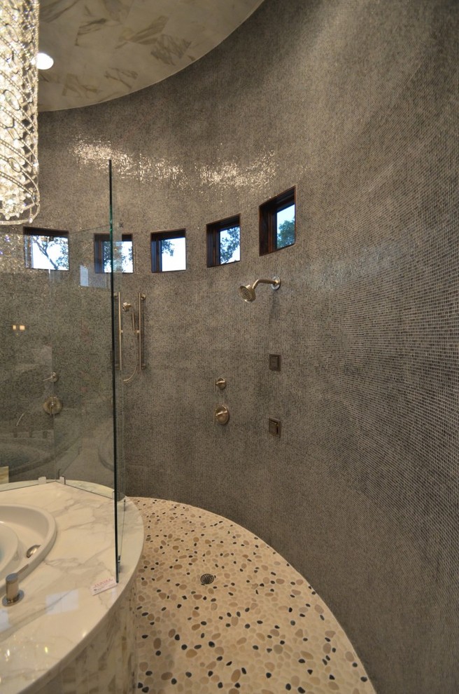 Design ideas for a large transitional master bathroom in Austin with shaker cabinets, medium wood cabinets, a hot tub, an alcove shower, gray tile, mosaic tile, multi-coloured walls, porcelain floors, an undermount sink, marble benchtops, grey floor and a hinged shower door.