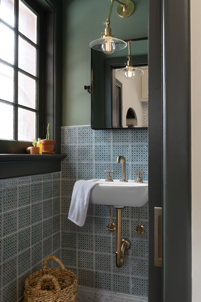Design ideas for a small transitional powder room in St Louis with green tile, ceramic tile, green walls and a wall-mount sink.