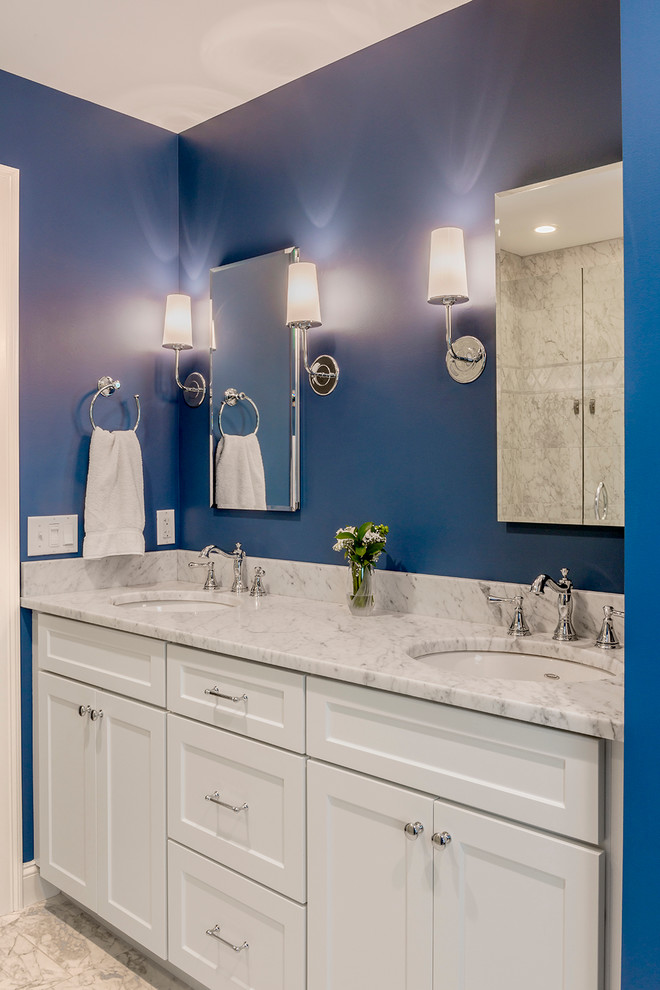 Mid-sized transitional master bathroom in Boston with flat-panel cabinets, white cabinets, a one-piece toilet, gray tile, ceramic tile, blue walls, ceramic floors, an undermount sink and granite benchtops.