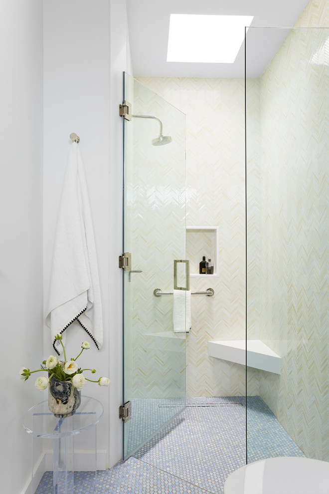 This is an example of a mid-sized eclectic bathroom in Los Angeles with flat-panel cabinets, blue cabinets, white tile, glass tile, white walls, porcelain floors, blue floor, a hinged shower door, white benchtops, a shower seat, a single vanity and a built-in vanity.