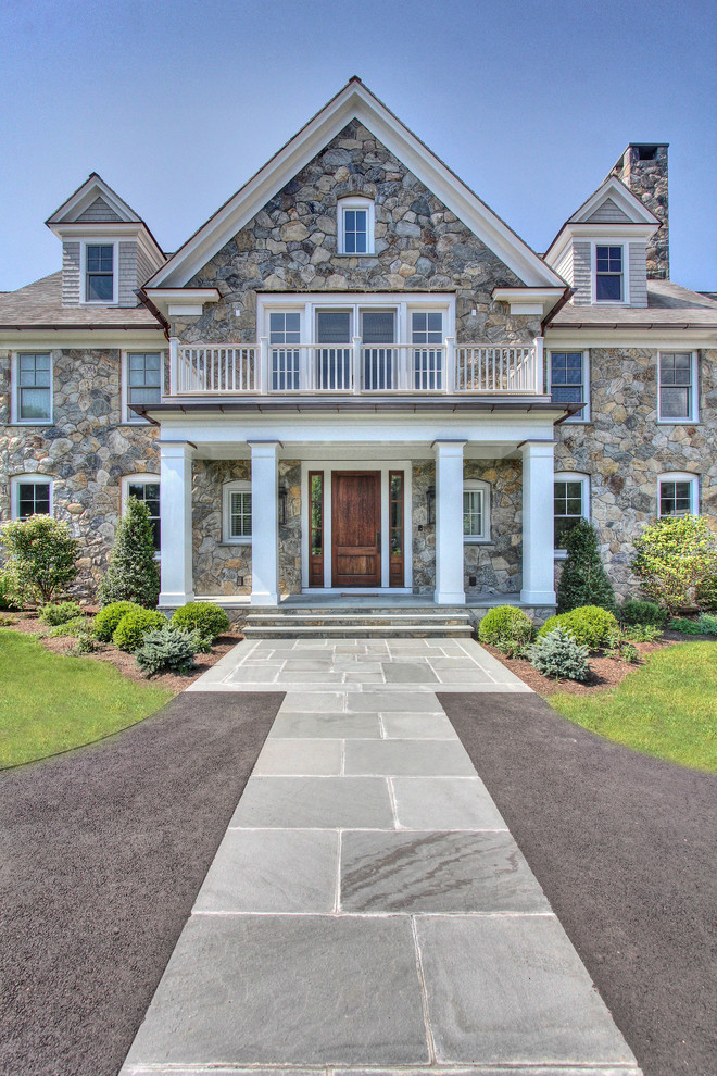 Inspiration for a large transitional three-storey grey exterior in Other with mixed siding.