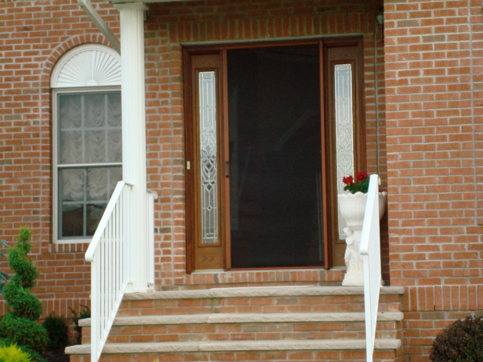 Mid-sized arts and crafts front door photo in New York with a medium wood front door