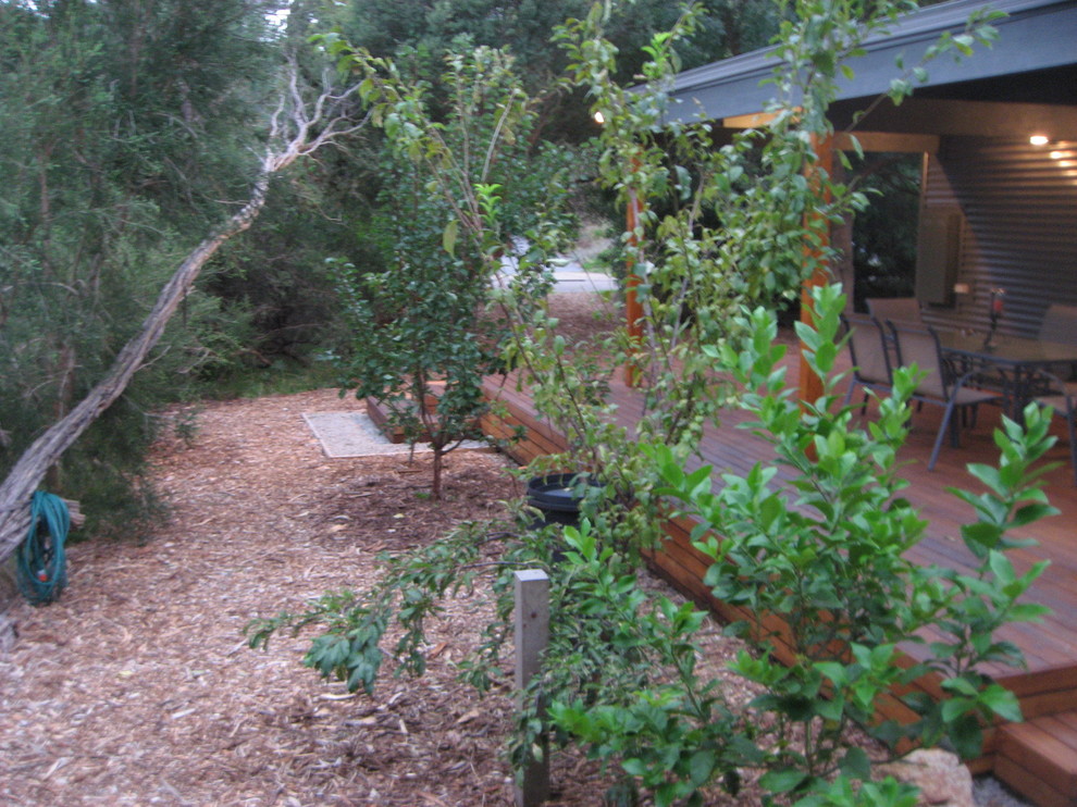 Inspiration for a small contemporary one-storey grey garden in Melbourne with metal siding, a gable roof and a metal roof.