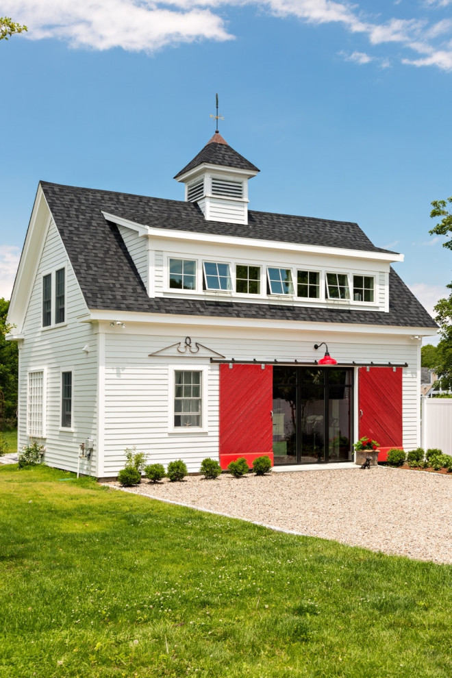 Photo of a white rural house exterior in Boston with wood cladding, a lean-to roof and shiplap cladding.