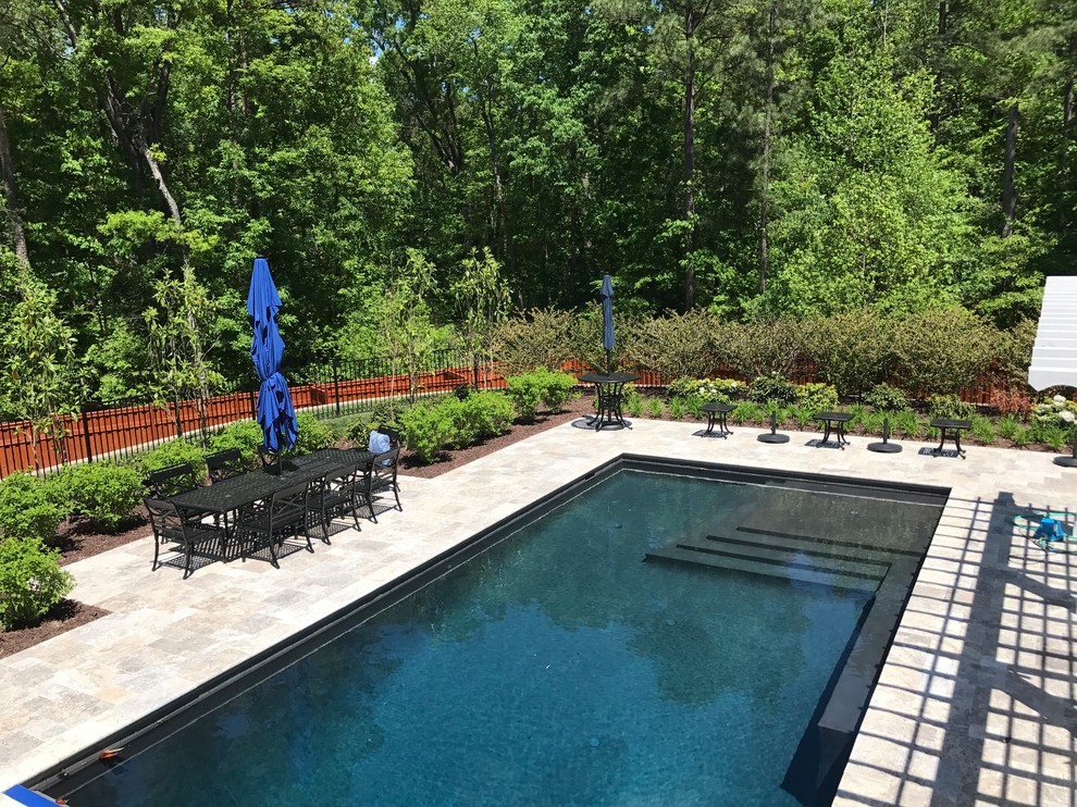 Huge transitional backyard stone and rectangular natural pool photo in Richmond