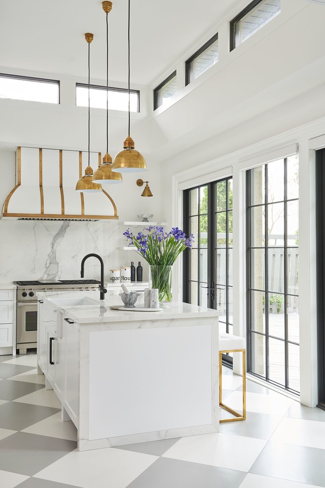 Inspiration for a transitional kitchen in Toronto with a farmhouse sink, white cabinets, marble benchtops, white splashback, marble splashback, stainless steel appliances, with island and multi-coloured floor.