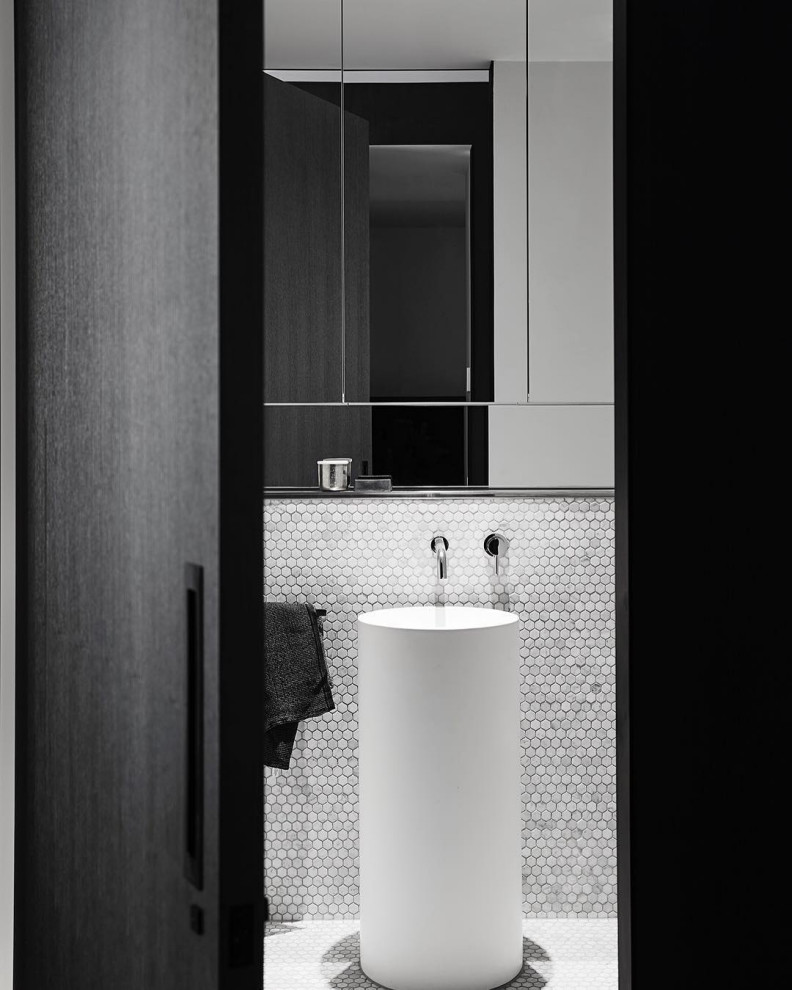 This is an example of a contemporary bathroom in Melbourne with mosaic tile, mosaic tile floors, a pedestal sink and a single vanity.