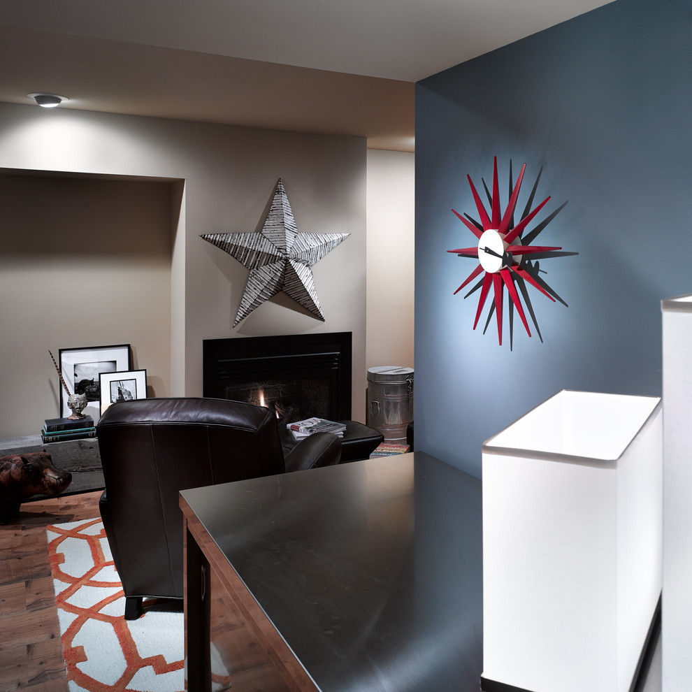 Home design - mid-sized transitional underground vinyl floor home design idea with blue walls, a standard fireplace and a metal fireplace