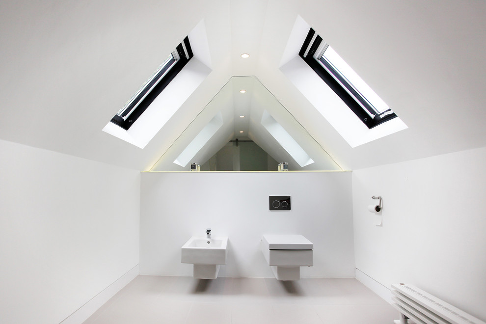 Design ideas for a mid-sized contemporary bathroom in Manchester with a wall-mount toilet, white walls and ceramic floors.