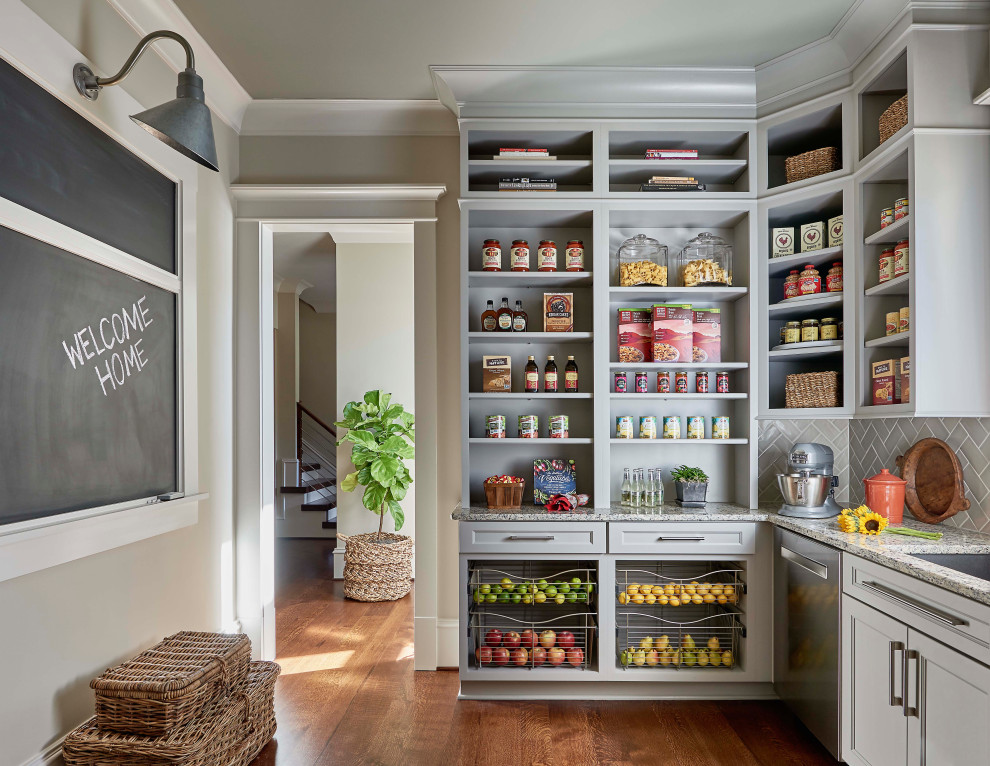 Country l-shaped kitchen pantry in Raleigh with an undermount sink, open cabinets, grey cabinets, grey splashback, stainless steel appliances, medium hardwood floors and multi-coloured benchtop.