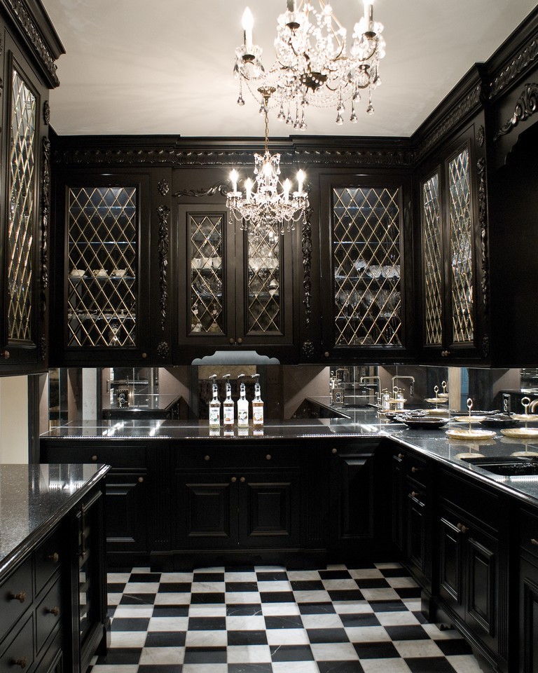 Mid-sized eclectic l-shaped kitchen in Cleveland with glass-front cabinets, black cabinets, marble floors, an undermount sink, mirror splashback, no island, multi-coloured floor and panelled appliances.