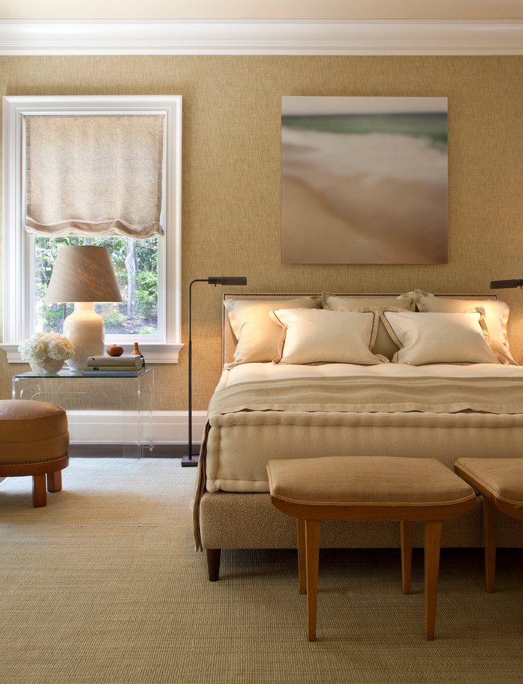 Photo of a transitional bedroom in New York with beige walls.