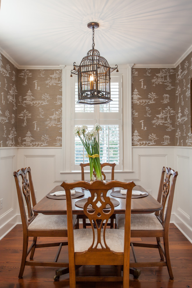 Photo of a traditional separate dining room in Charleston with brown walls, medium hardwood floors, no fireplace and brown floor.