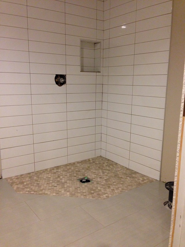 Installed shower tile darker installed than on sample.