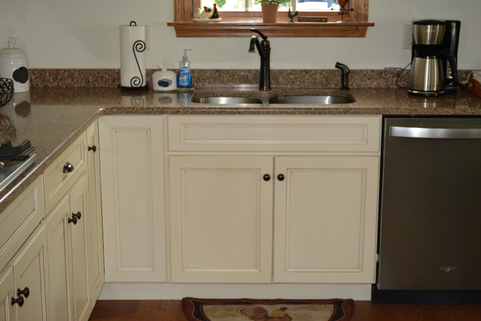 Eat-in kitchen - small transitional l-shaped medium tone wood floor and brown floor eat-in kitchen idea with an undermount sink, flat-panel cabinets, beige cabinets, quartz countertops, stainless steel appliances, an island and brown countertops