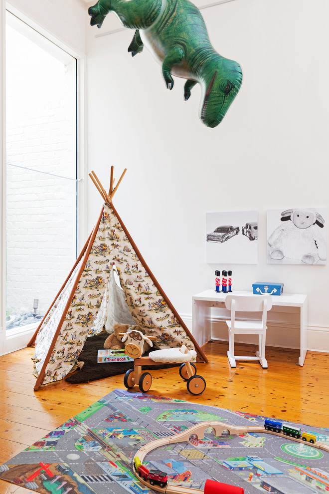 Inspiration for an eclectic kids' playroom in Melbourne with medium hardwood floors.