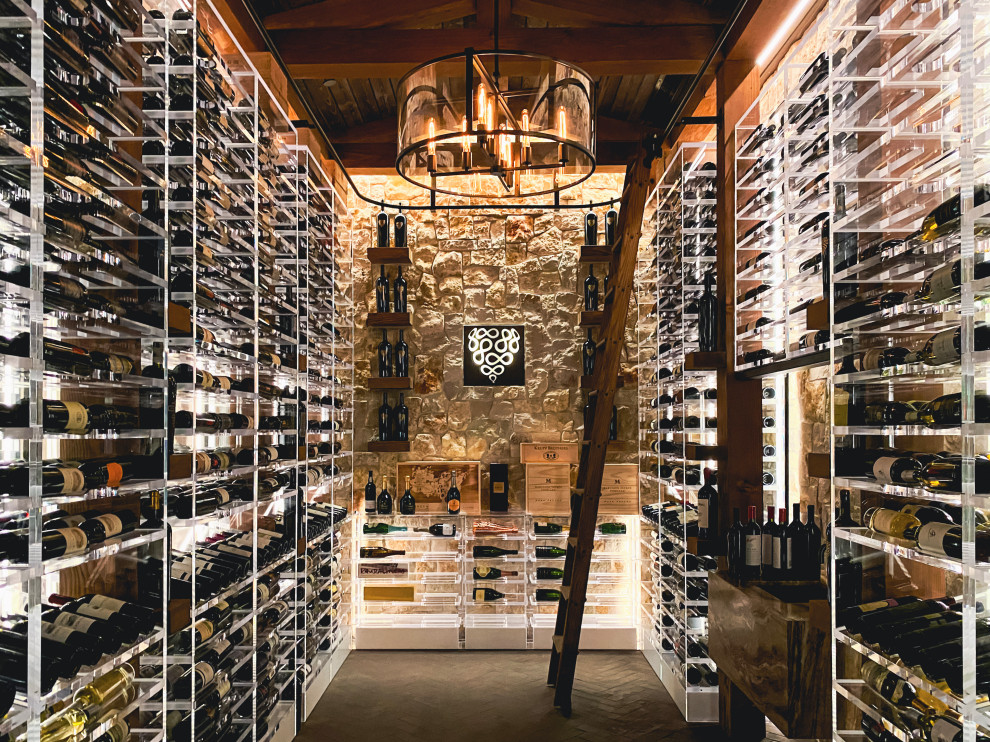 Inspiration for a large industrial brick floor and gray floor wine cellar remodel in San Francisco with storage racks