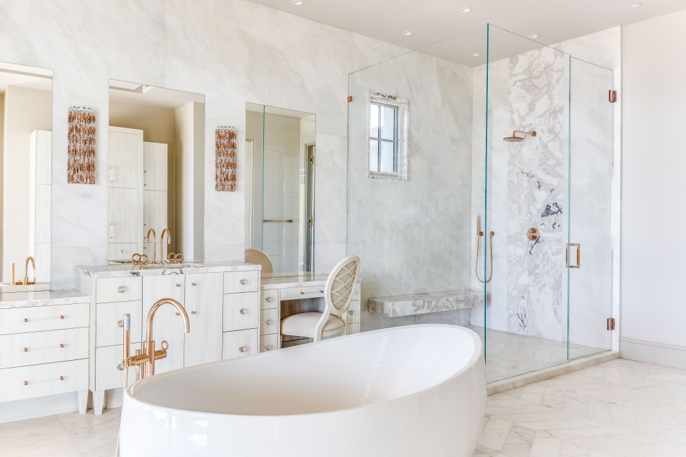 This is an example of a large contemporary master bathroom in Orange County with a freestanding tub, white tile, marble, white floor, a hinged shower door, a shower seat, flat-panel cabinets, white cabinets, a double shower, a drop-in sink, quartzite benchtops, pink benchtops, a single vanity and a built-in vanity.