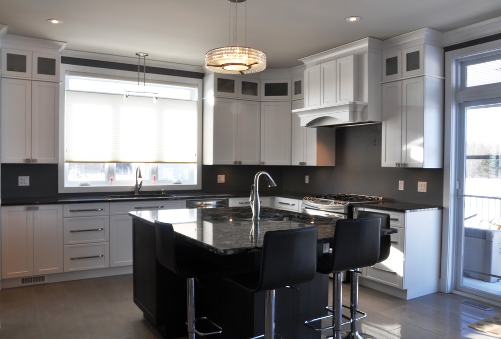 Enclosed kitchen - large transitional l-shaped ceramic tile enclosed kitchen idea in Ottawa with an undermount sink, shaker cabinets, white cabinets, granite countertops, stainless steel appliances and an island
