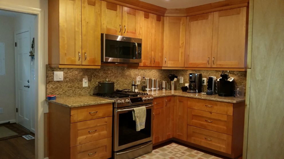 Inspiration for a transitional kitchen remodel with shaker cabinets, light wood cabinets, granite countertops and stone slab backsplash