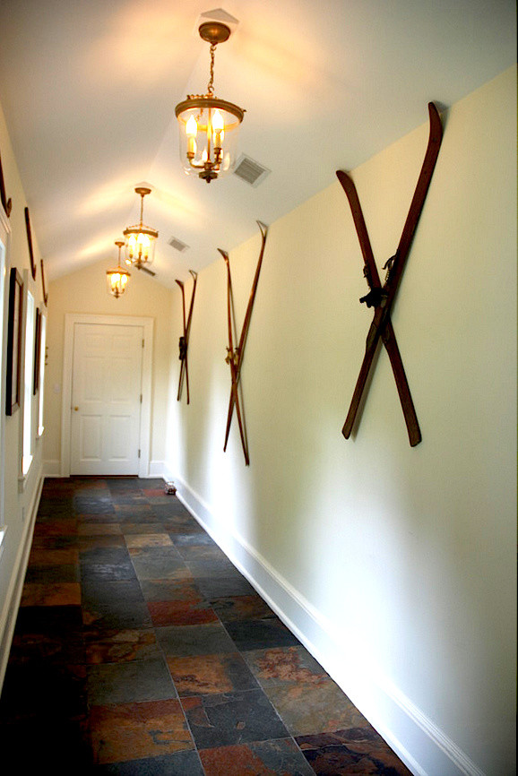 Photo of a mid-sized country hallway in Bridgeport with yellow walls and slate floors.