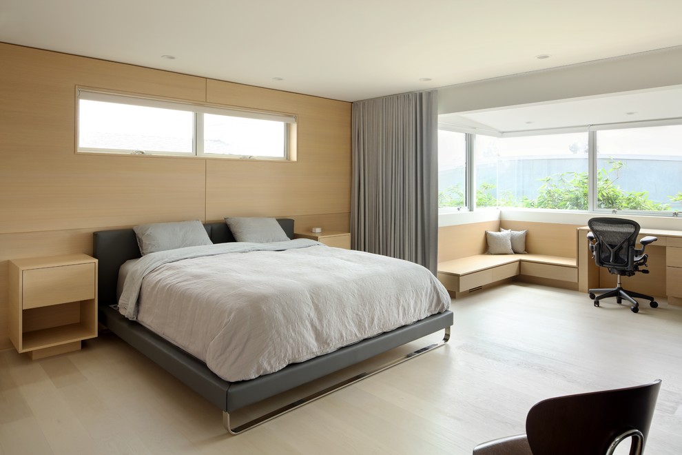 Design ideas for a large scandinavian master bedroom in Los Angeles with light hardwood floors, beige floor, beige walls and no fireplace.