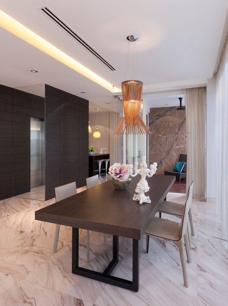 Contemporary dining room in Singapore with white walls.