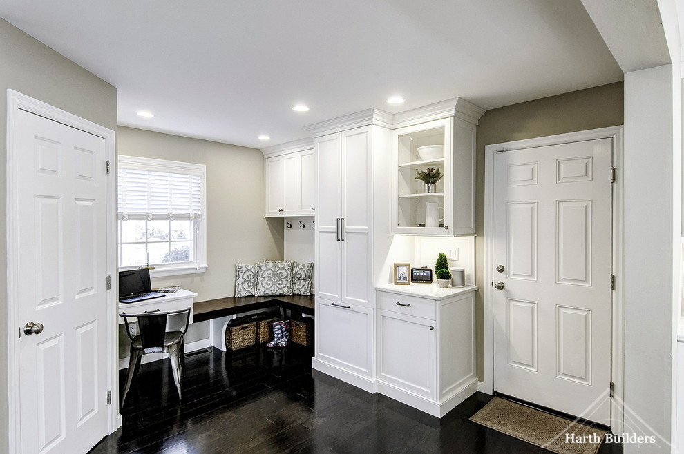 Mid-sized transitional dark wood floor mudroom photo in Philadelphia with beige walls and a white front door