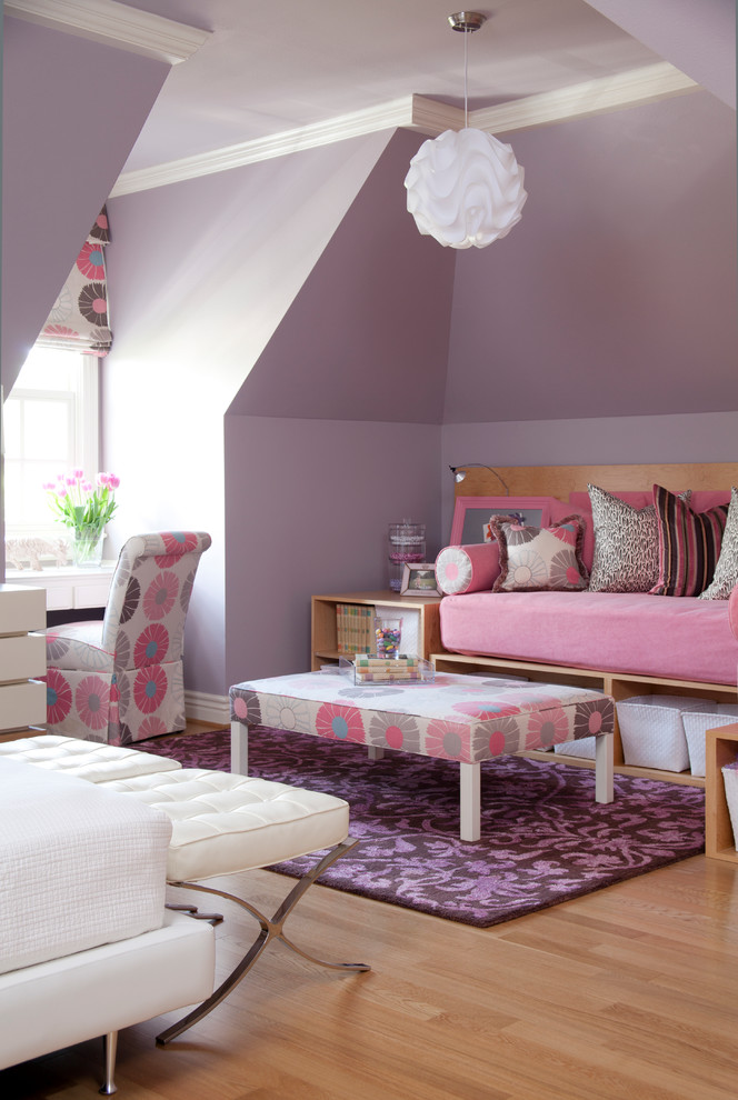 Design ideas for a large traditional kids' bedroom for kids 4-10 years old and girls in Little Rock with purple walls and light hardwood floors.