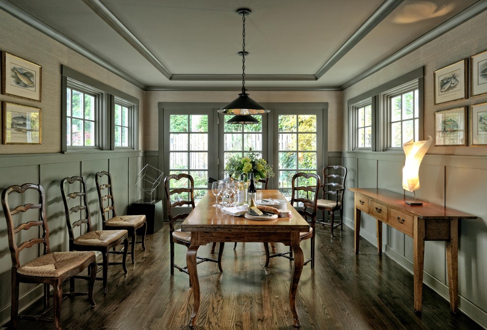 Inspiration for a traditional dining room in Seattle with grey walls and dark hardwood floors.