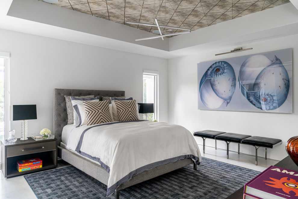 Midcentury bedroom in Miami with white walls, grey floor and wallpaper.
