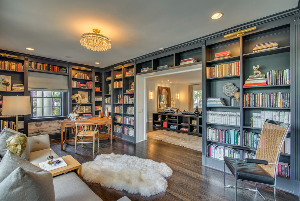Design ideas for a transitional home office in Nashville with a library, multi-coloured walls, dark hardwood floors, a freestanding desk and brown floor.