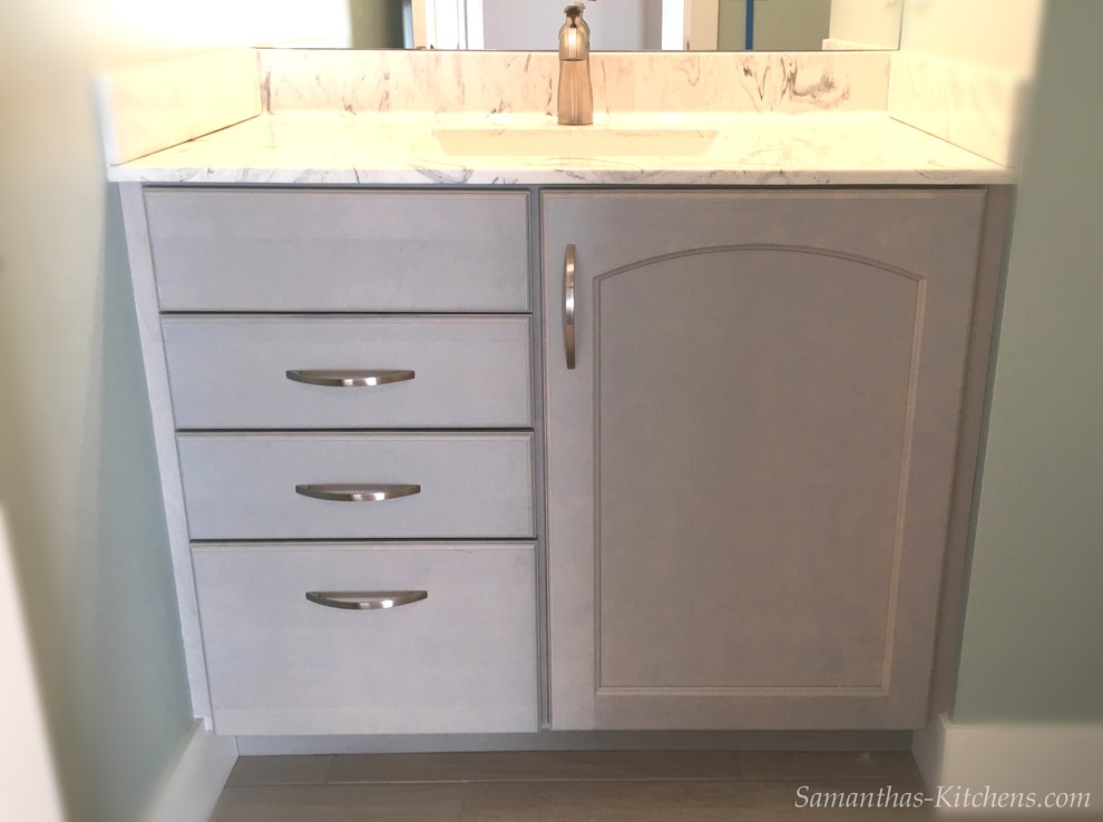 Example of a mid-sized transitional kids' porcelain tile home design design with recessed-panel cabinets, gray cabinets, blue walls, an integrated sink and marble countertops