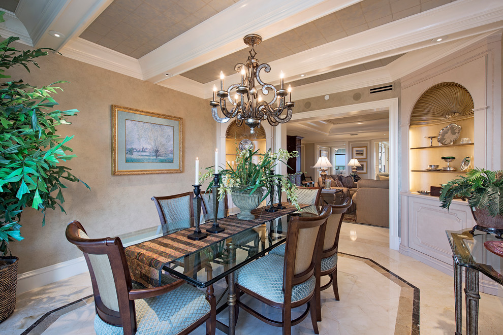 Example of a classic dining room design in Houston with beige walls and no fireplace