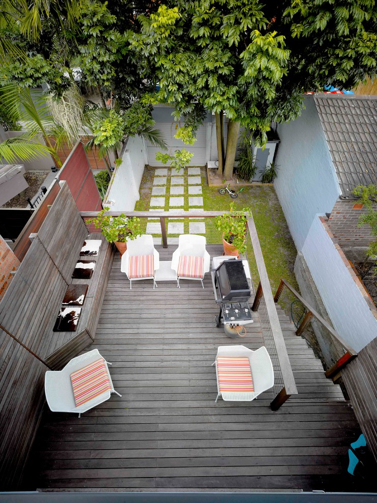 Mid-sized contemporary backyard deck in Sydney with no cover.